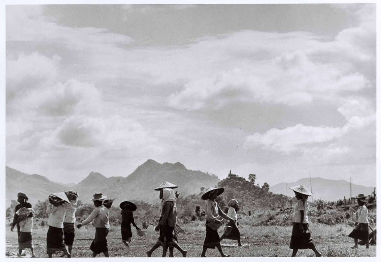 Women walking under midday sun, near Nam Định, Vietnam, May 1954  Robert Capa / International Center of Photography / Magnum Photos / Capa Center – Budapest Photos: Hungarian Collection of The Robert Capa Photographs – Robert Capa Contemporary Photography Center, Budapest 