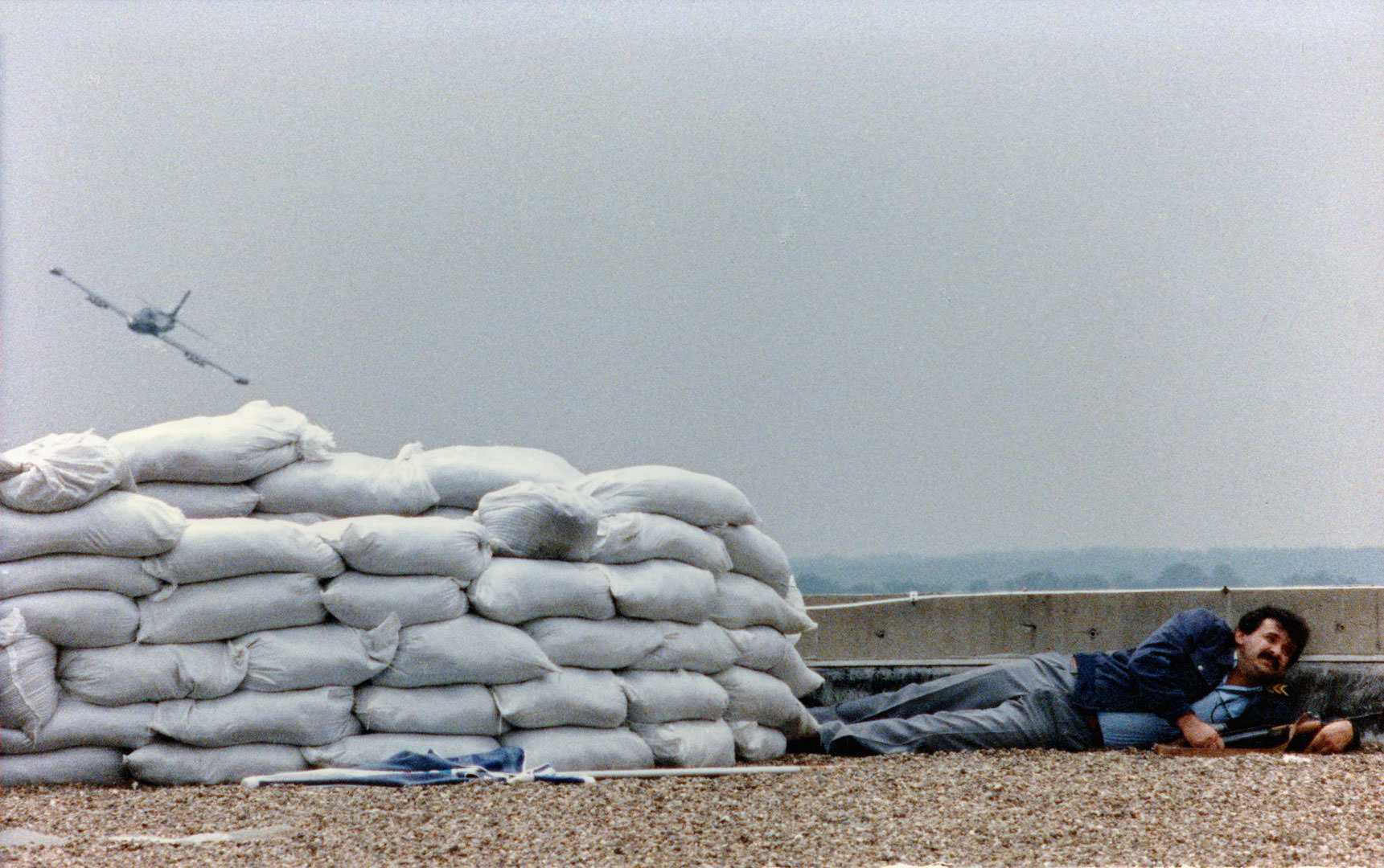 Balogh László: Eszéki reptér, 1991 (A Yugoslav Federal Air Force jet flies over a holed up Croatian soldier at Osijek airport on August 5, 1991. The airport and the whole of Osijek at the time was in Croatian hands but surrounded by Serbian forces.)